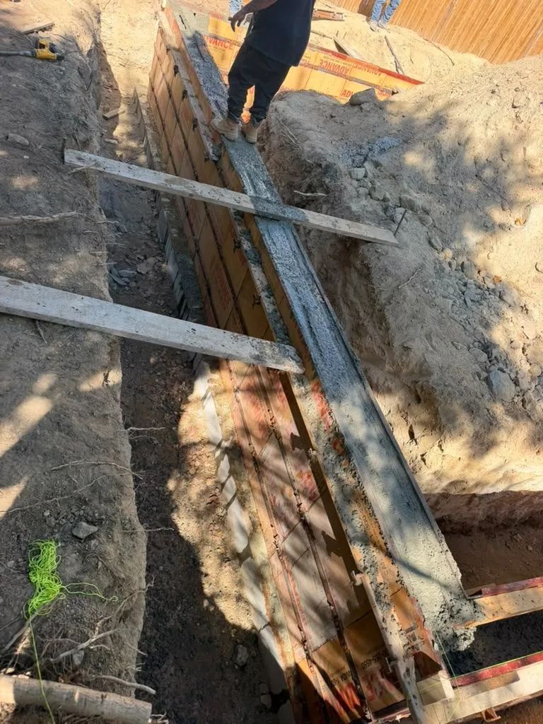 Crew on top of braced foundation wall forms