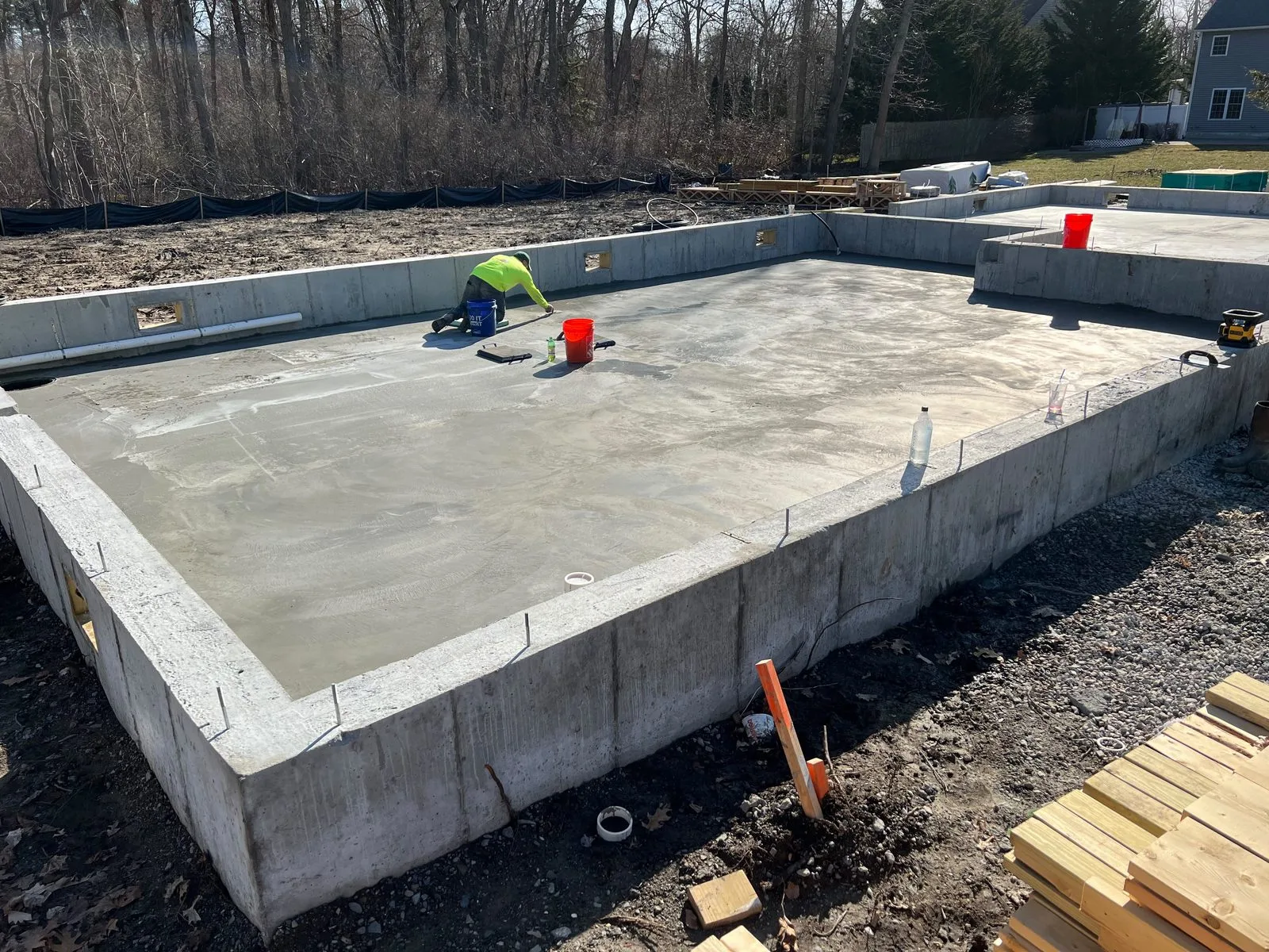 Finisher working a new concrete slab