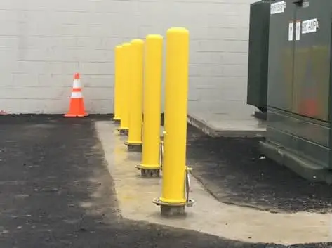 Bollards set in a new concrete pad