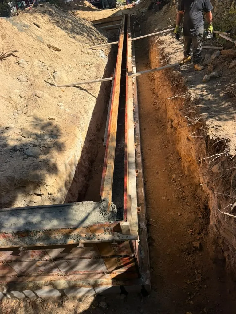 Braced footing forms in a deep excavation