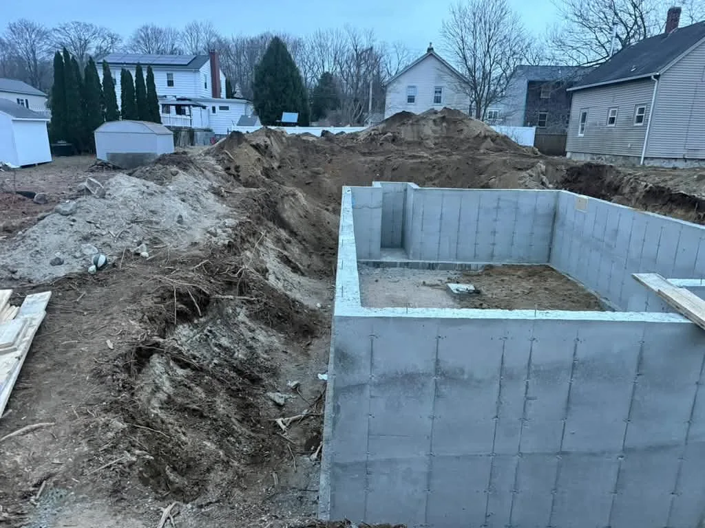 Stripped foundation walls on a residential lot