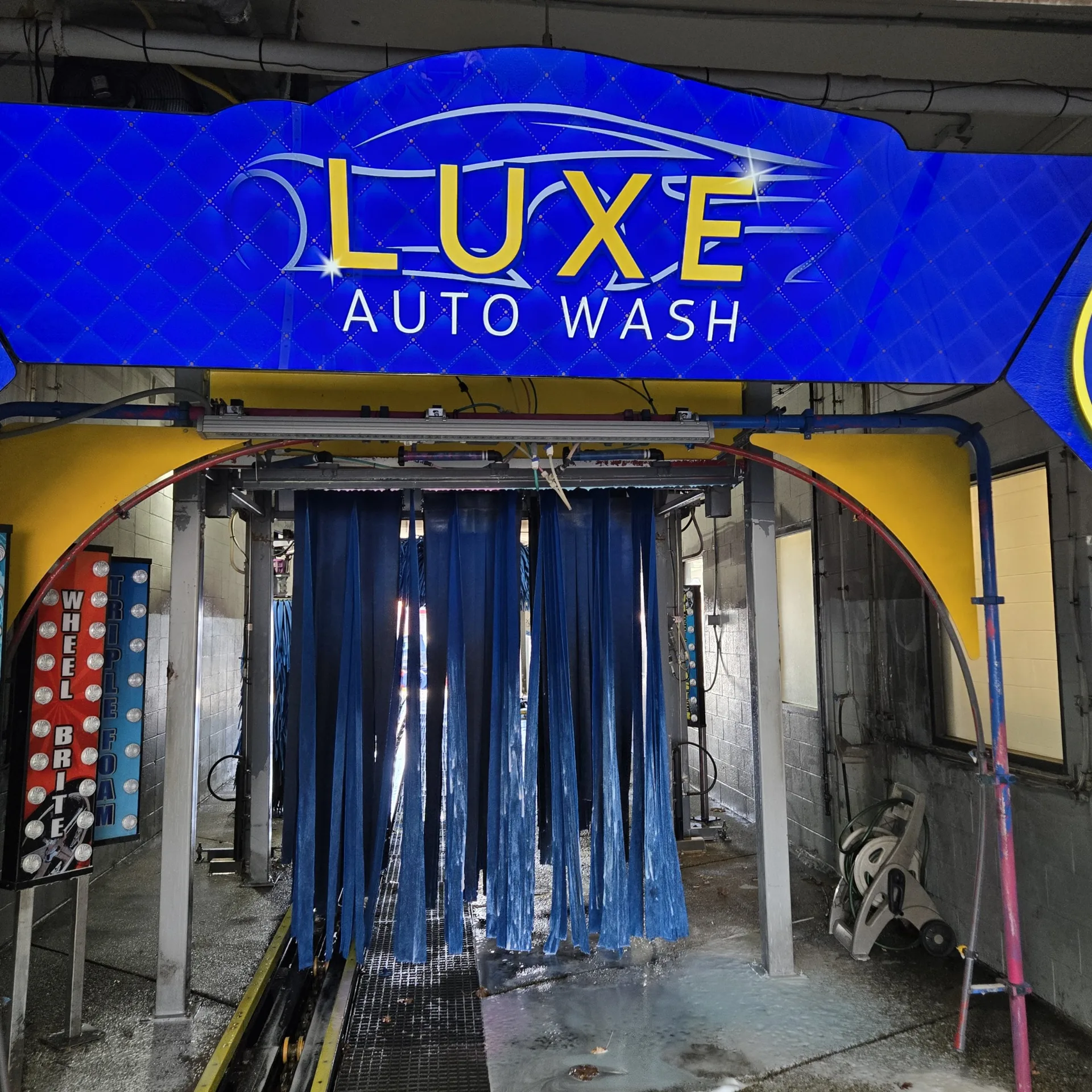 Soft-touch cloth brushes inside the Luxe Auto Wash tunnel